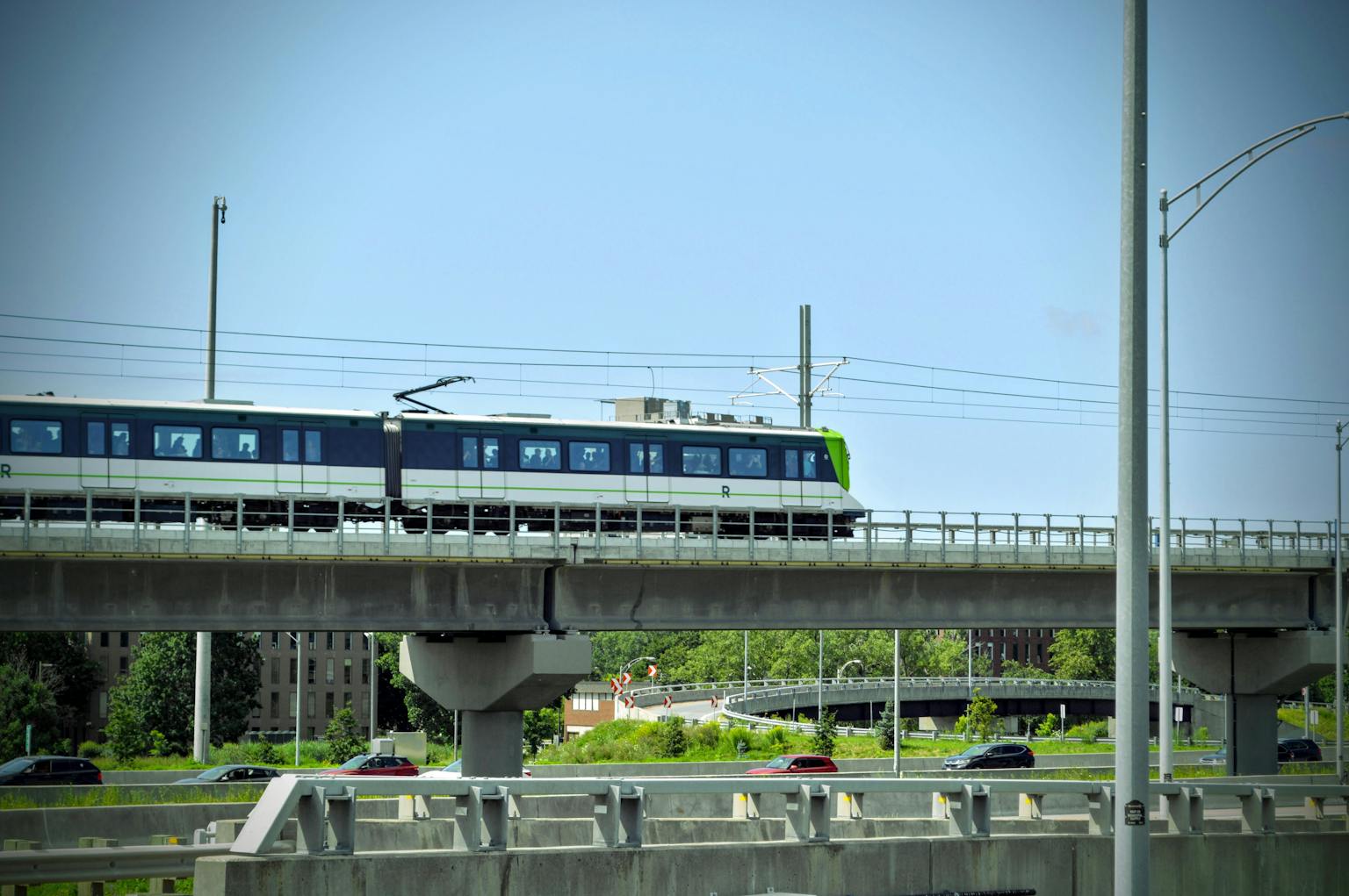 REM train of montreal crossing a bridge